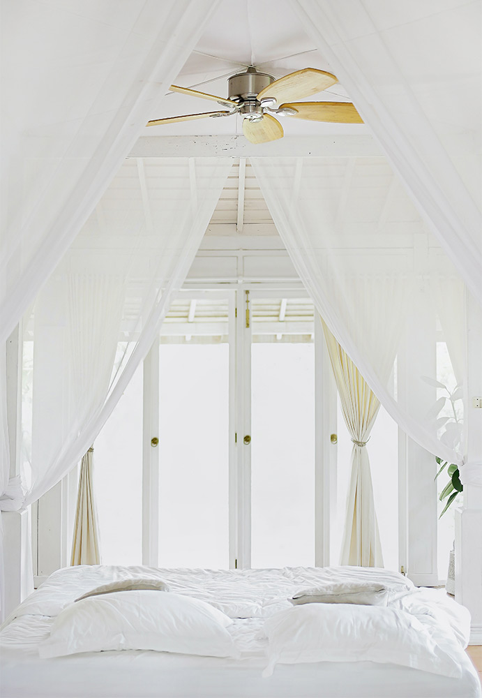 White themed bedroom design with a designer ceiling fan - Beautiful Homes