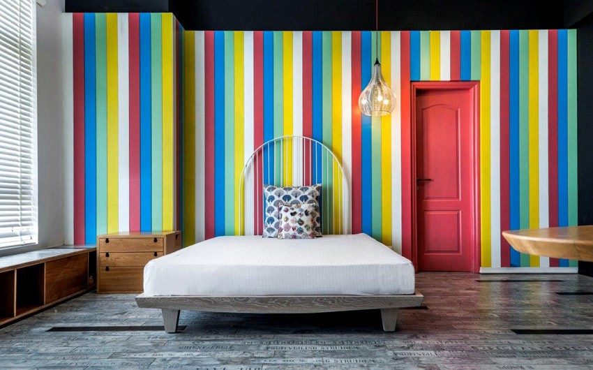 Bedroom with colourful striped wall paint design & simple furniture for bedroom décor - Beautiful Homes