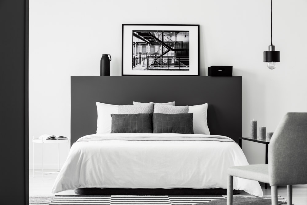 Wall art & photo frames for black & white themed bedroom interior design - Beautiful Homes