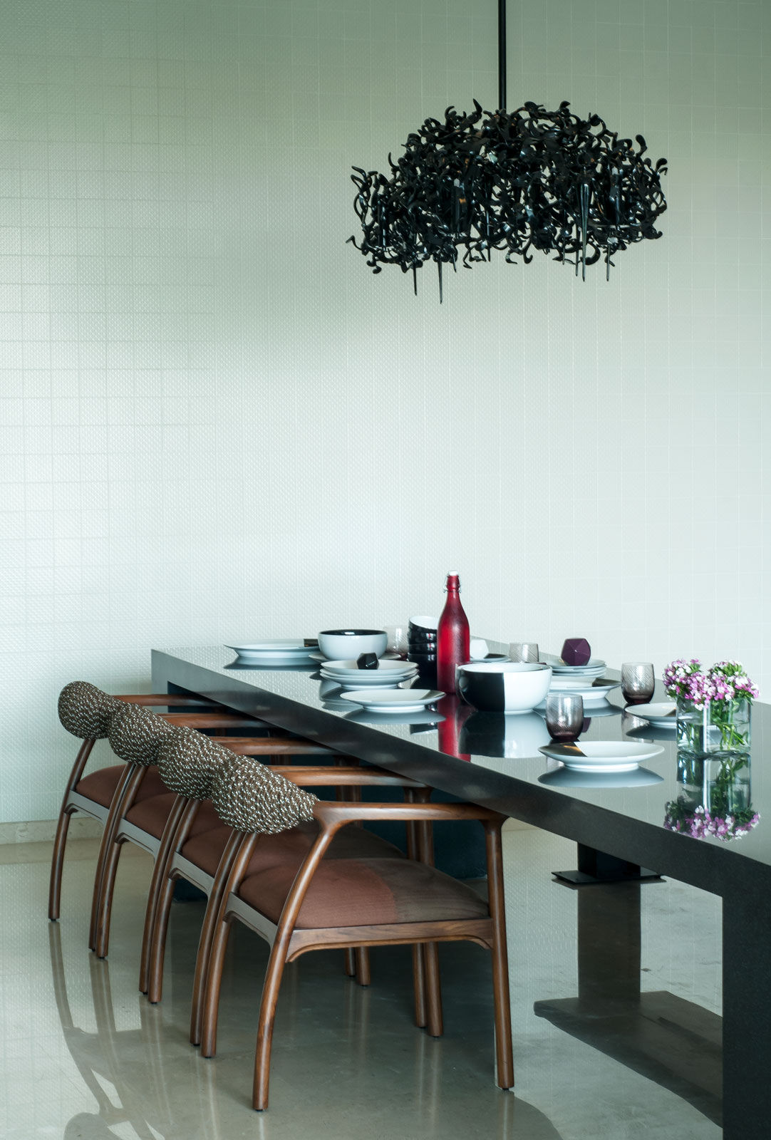 A statement lighting fixture above the dining table - Beautiful Homes