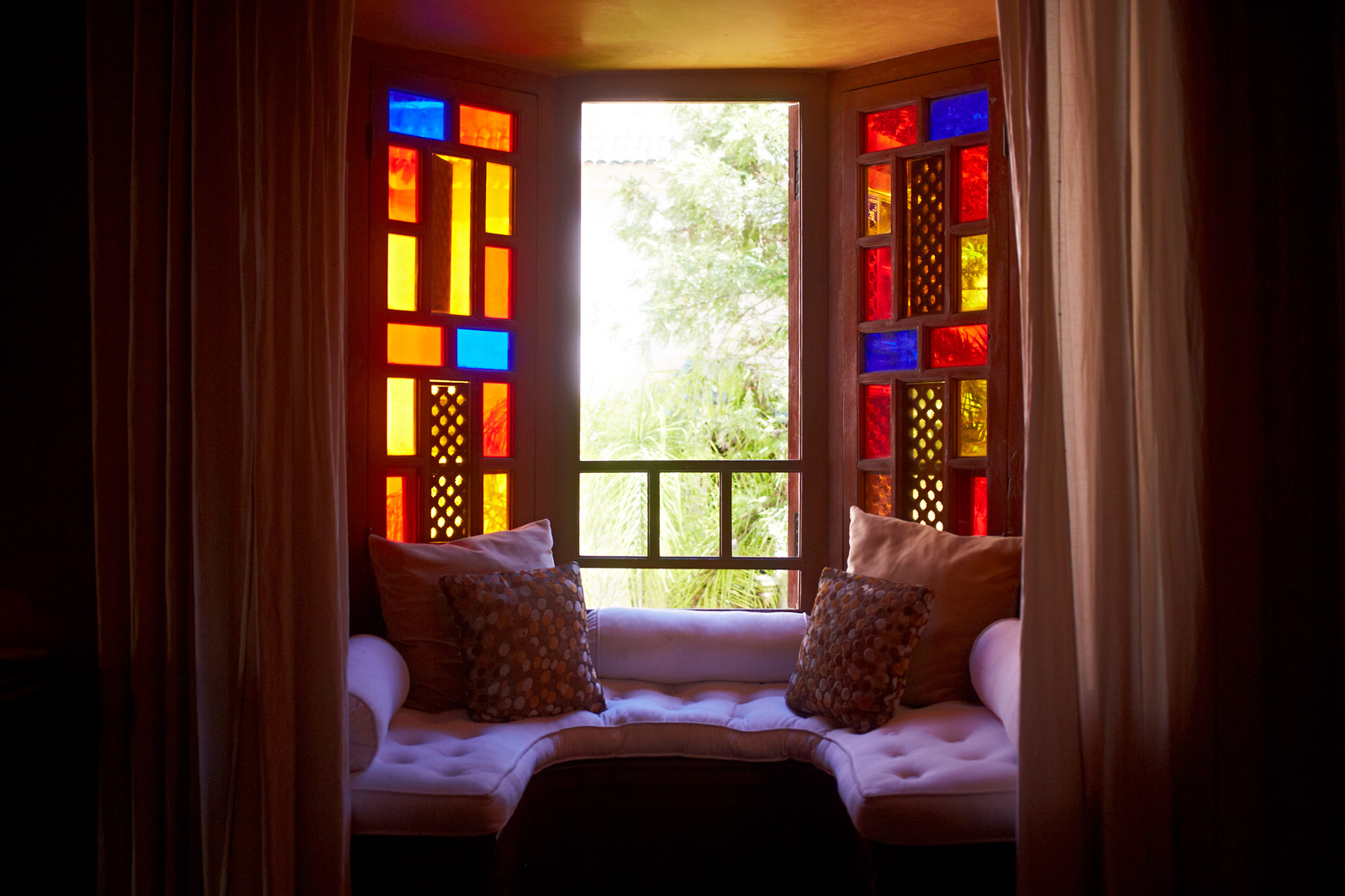 Gaddas placed on the window ledge to make for more seating - Beautiful Homes