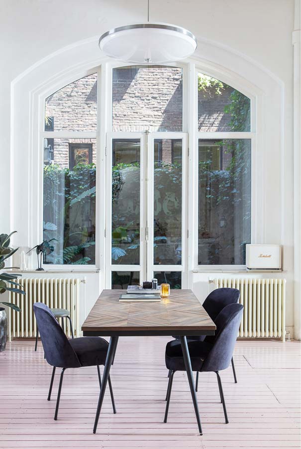 Teak wood dining table in urban interior design - Beautiful Homes