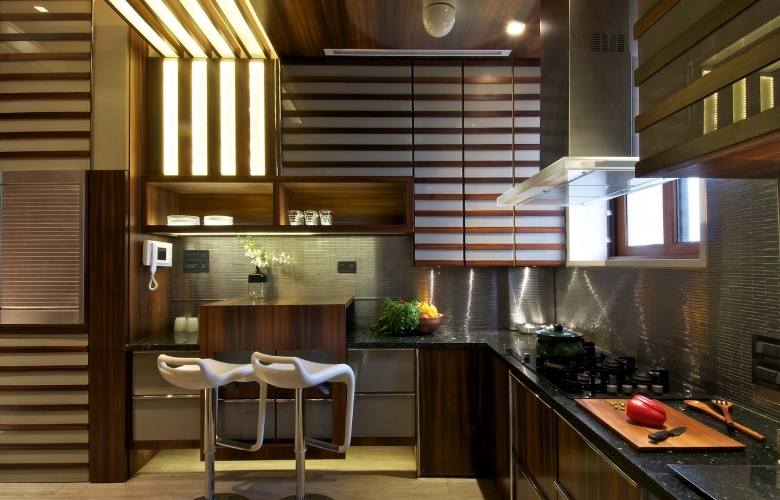 Wooden kitchen design with steel backsplash - Beautiful Homes