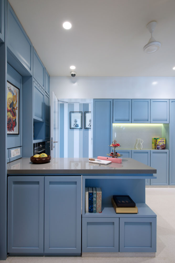 A cool toned dusky blue pastel kitchen colour for your modular kitchen design - Beautiful Homes