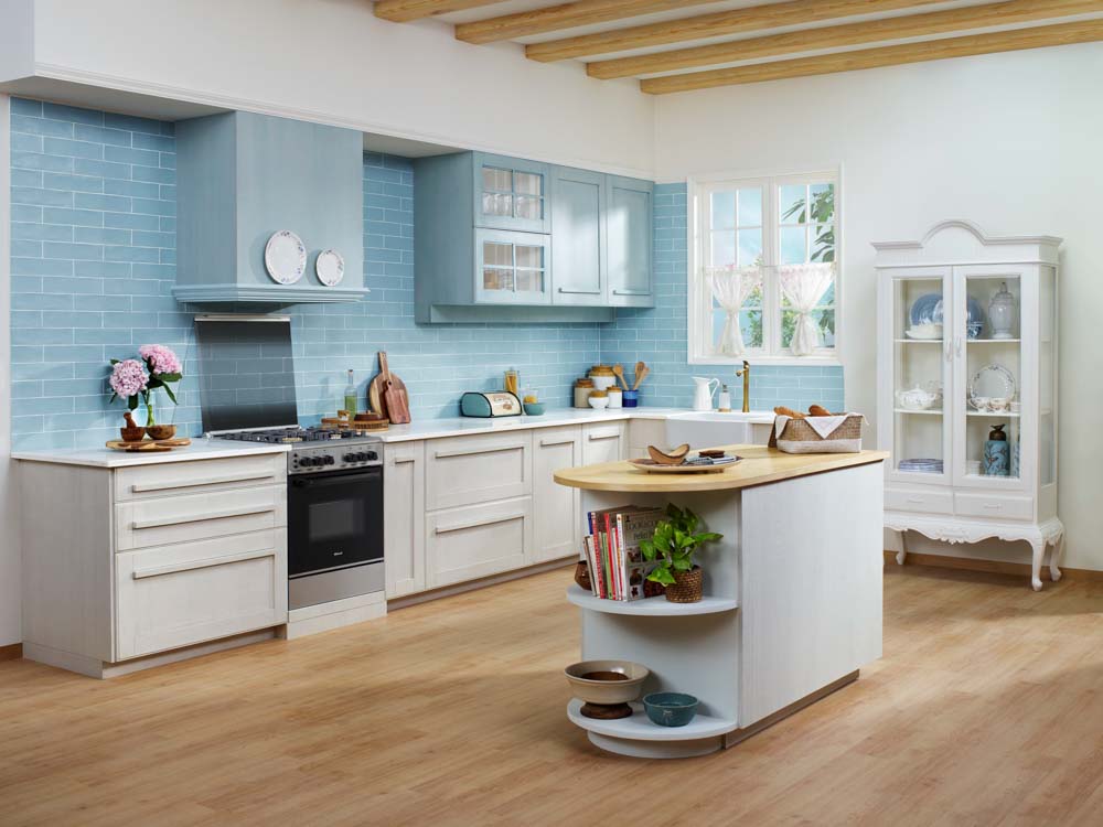 Spa blue & white kitchen colour palette with wooden flooring & mini kitchen island- Beautiful Homes