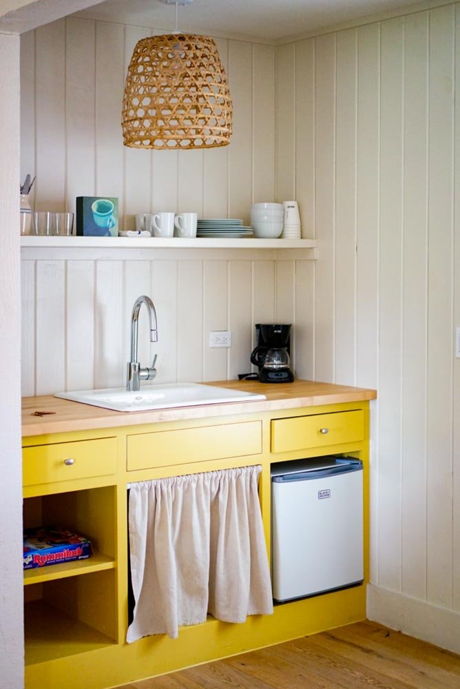 White & yellow kitchen colour with wood counters & wooden flooring - Beautiful Homes