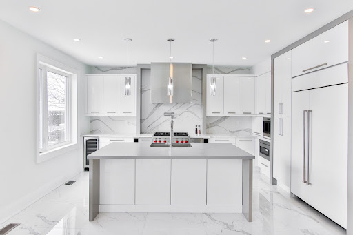 Sleek & steel modern parallel kitchen design with white colour palette - Beautiful Homes