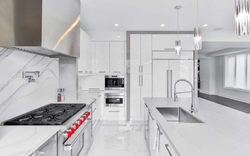 Chic parallel modular kitchen design with acrylic finish & marble flooring - Beautiful Homes