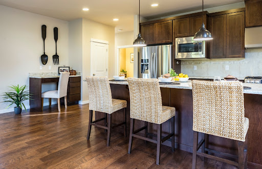 Wooden parallel modular kitchen design with breakfast nook on kitchen island - Beautiful Homes