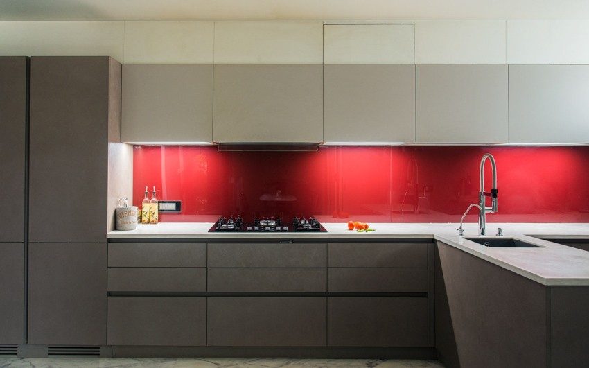 Modern Kitchen Design with Bright Red Backsplash in Glossy Finish in a Muted Kitchen - Beautiful Homes