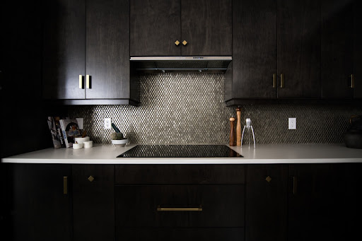 Metallic kitchen backsplash design for a small kitchen with dark colour palette - Beautiful Homes