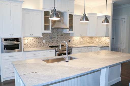 Mozaic pattern kitchen backsplash tile design for a galley modular kitchen - Beautiful Homes