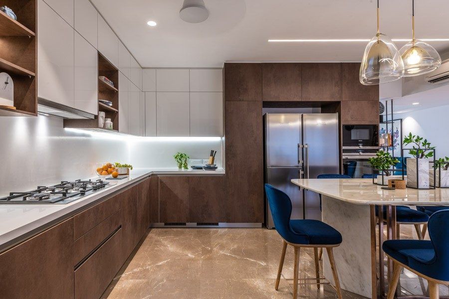 Neat wooden urban kitchen design with marble dining table and a few house plants