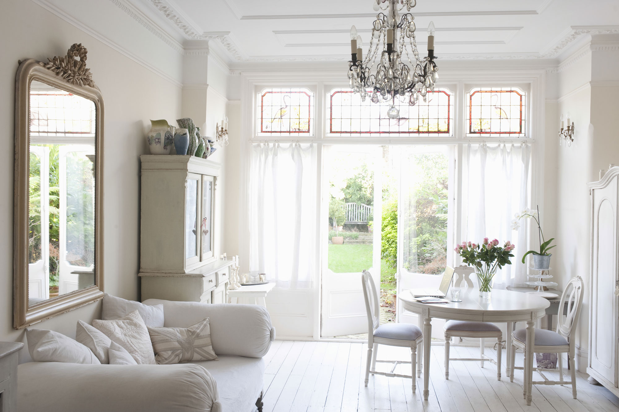 White Living Room Design Ideas With Natural Lights From Open Window, Vintage Chairs & Ornate Mirror - Beautiful Homes