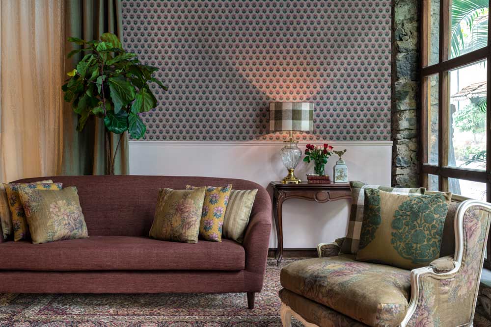 Brown sofa colour matching with wallpaper with intricate patterns in the living room - Beautiful Homes