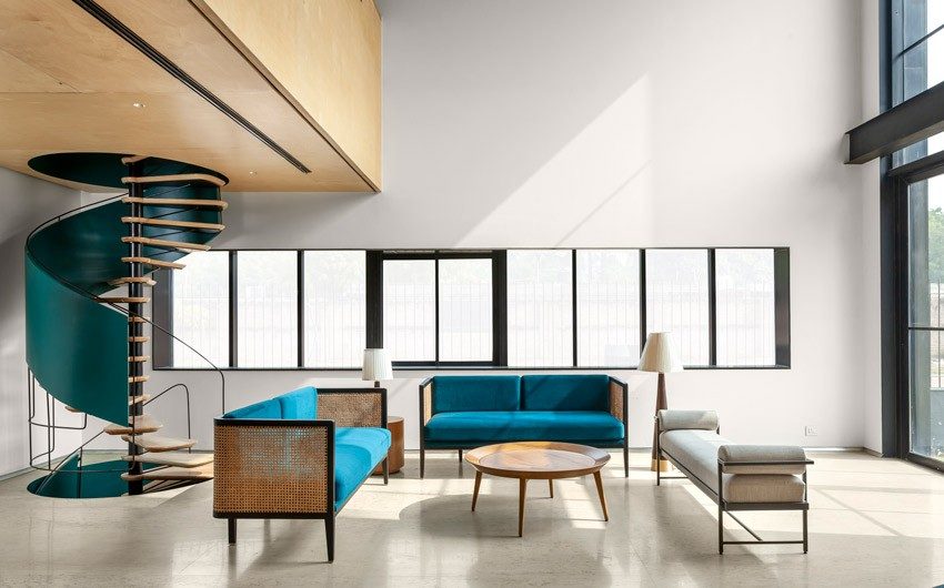 Sofa set & bench arranged around center table in this living room - Beautiful Homes