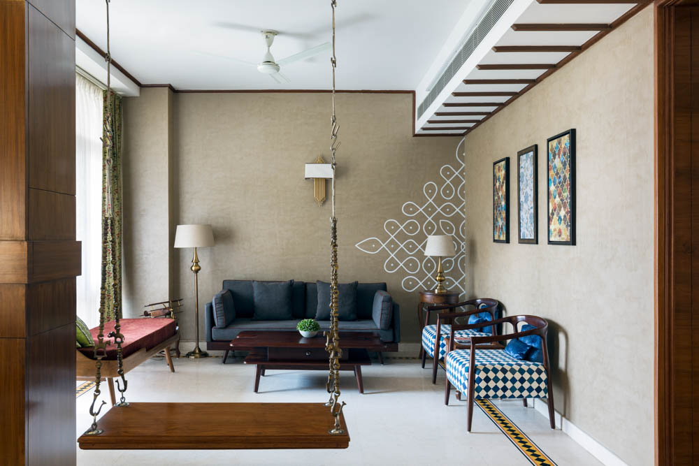Indian living room with sofa set, armchairs, bench & a swing in arrangement - Beautiful Homes