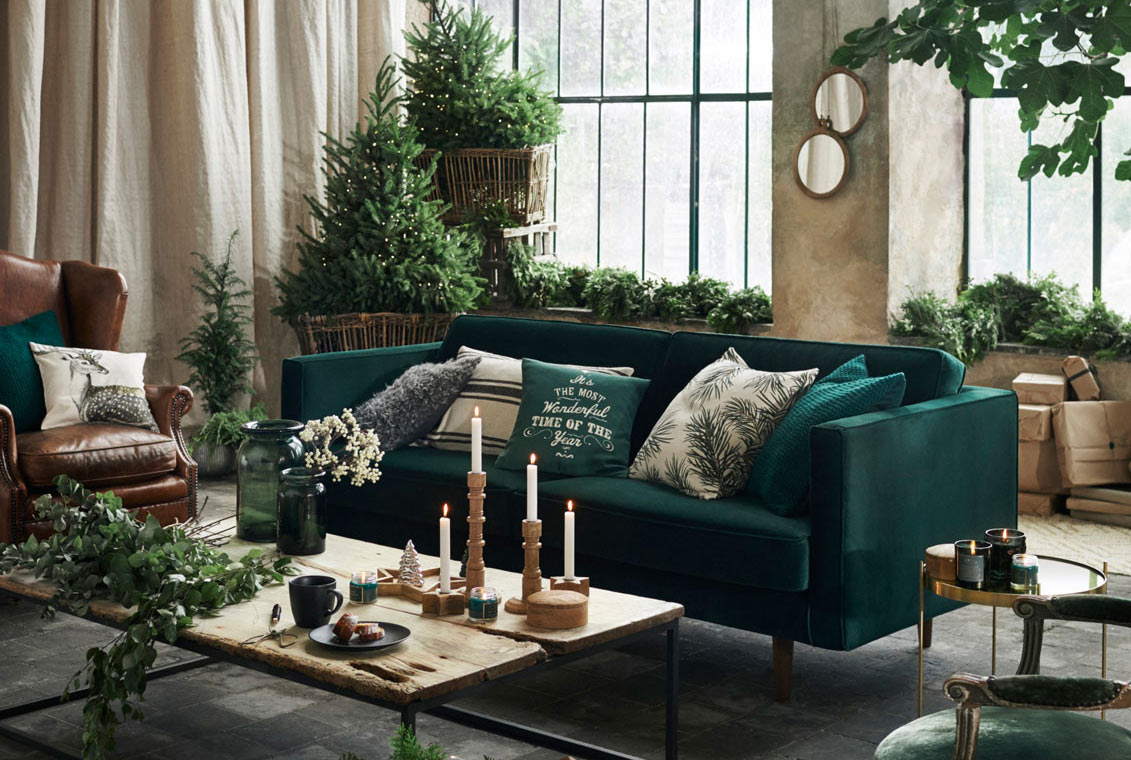 Décor Ideas for Christmas-Ready Living Room With Green Sofa & Candles on Wooden Table - Beautiful Homes