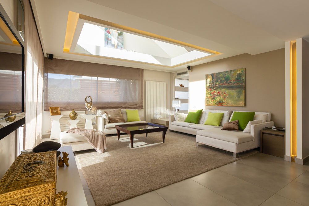 Chic false ceiling design around the skylight for modern living room design - Beautiful Homes