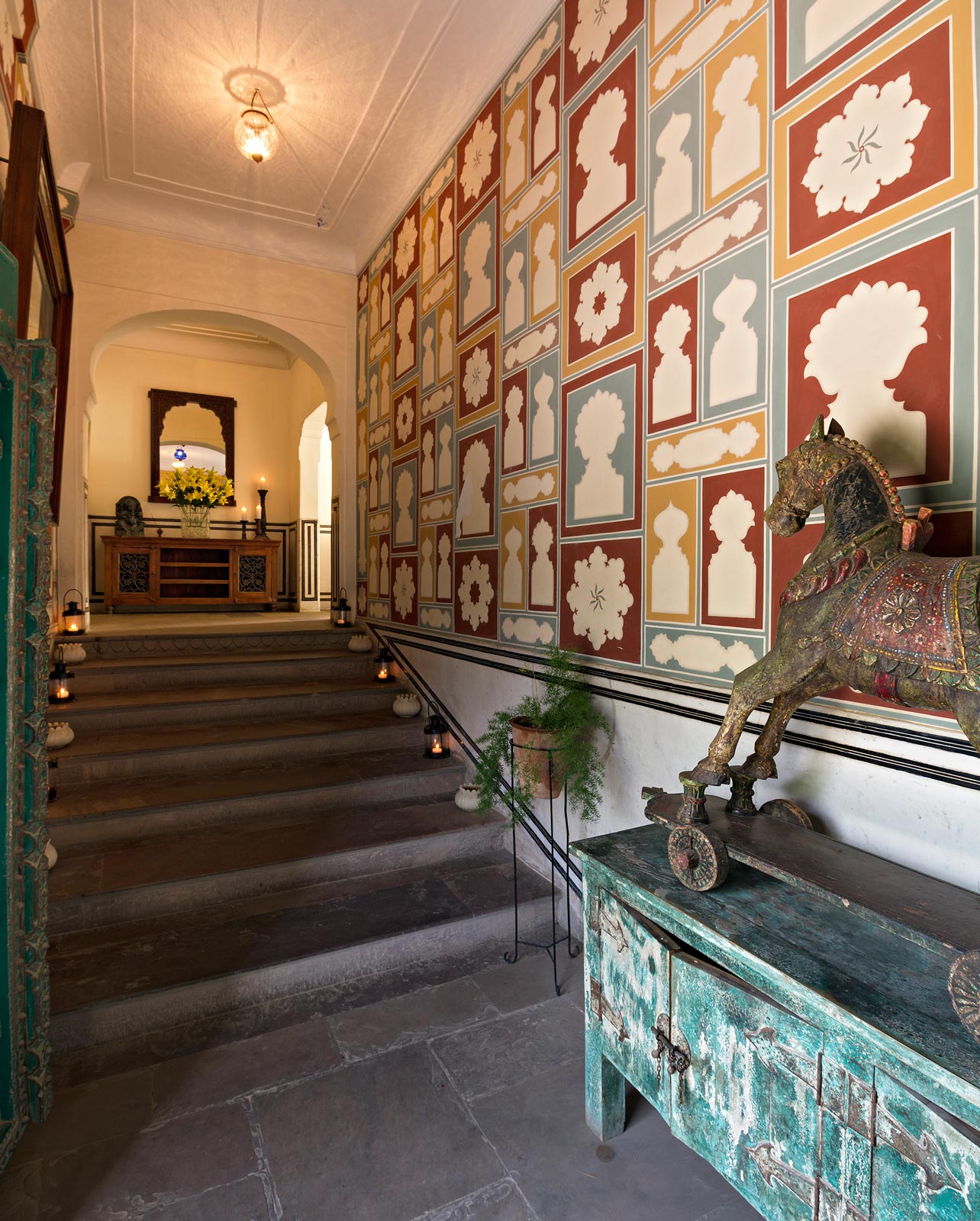 A feature wall with antique tiles in traditional patterns at the entryway - Beautiful Homes