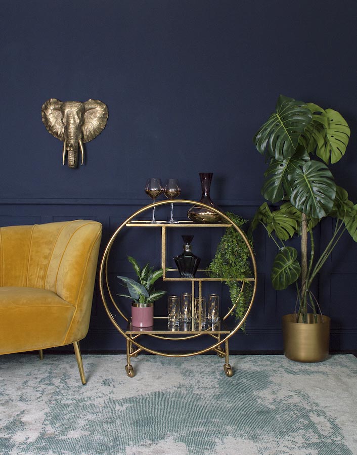 Golden Home Bar Design on Wheels, Yellow Sofa & Dark Blue Wall, Faded Carpet & A Few Plants - Beautiful Homes
