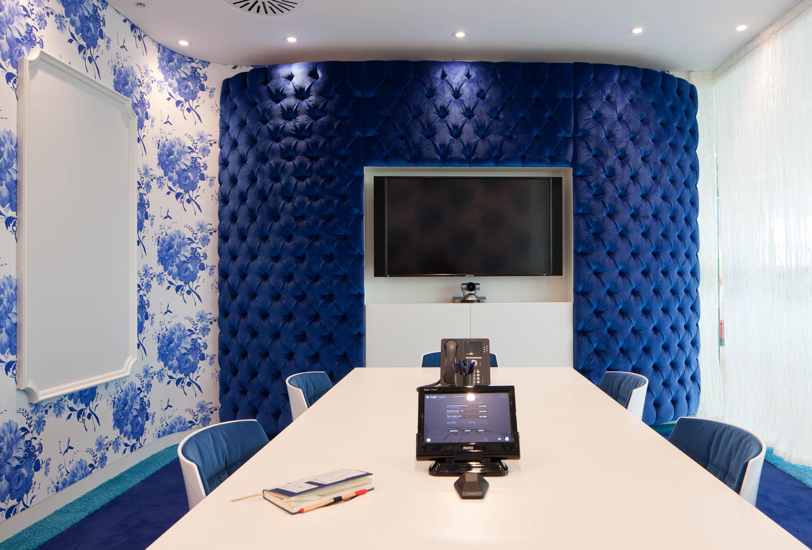 The Boardroom Wall Decorated with Floral Wallpaper and Tufted Wall Covering - Beautiful Homes