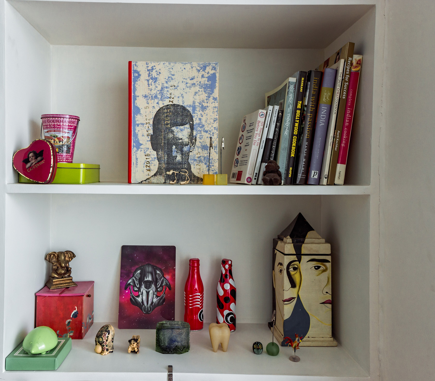 Interesting curios in the shelves surrounding the workspace.