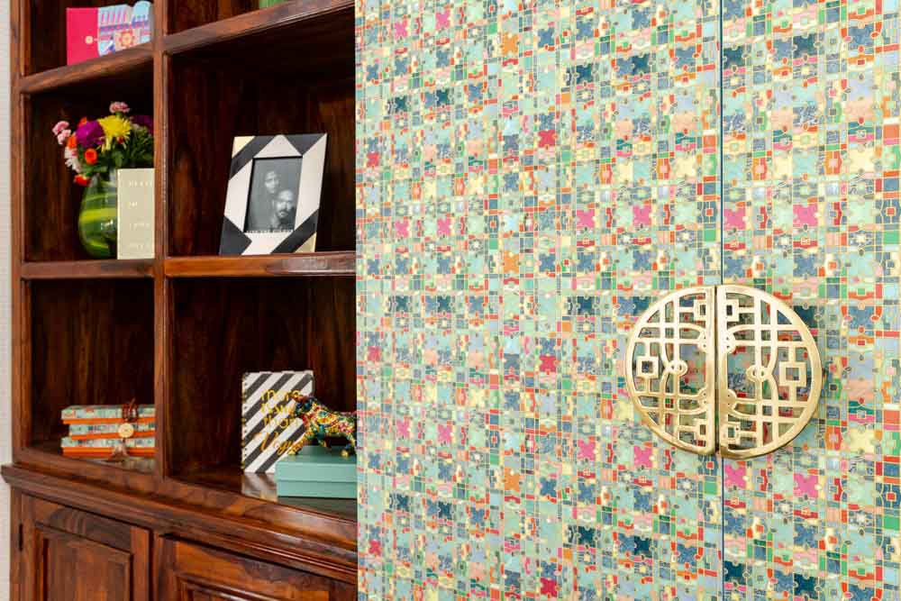 The bookcase design has custom cast sliding door handles inspired by the ZXP Logo - Beautiful Homes