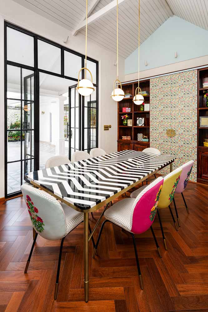 Modern conference room with pale blue walls paired with houndstooth wallpaper & wooden flooring - Beautiful Homes