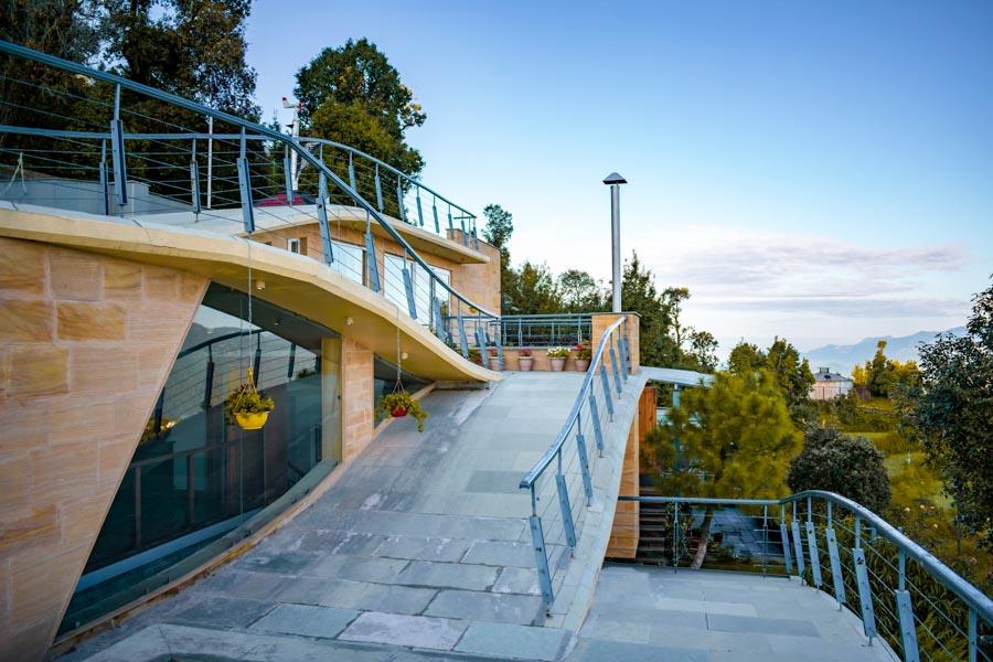 A pathway with railings as part of a house
