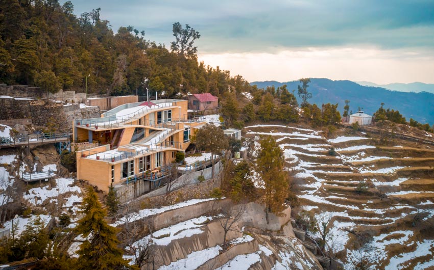 A house in the mountains surrounded by terrace farming