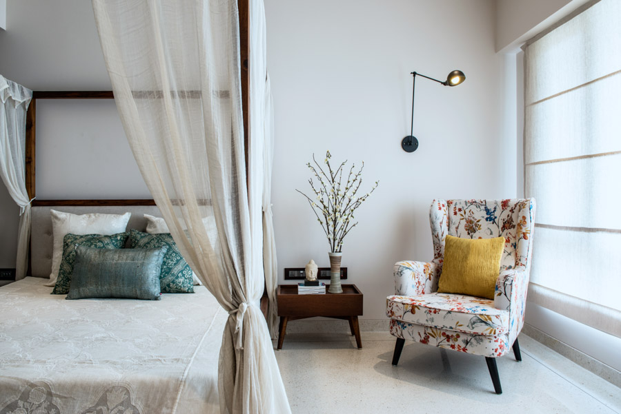 Classy bedroom adding Indian touches to clean Western lines: white bedspread and indigo cushions latest bedroom design - Beautiful Homes