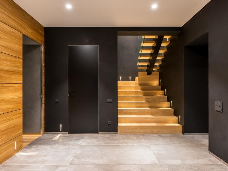 Black stair wall colour design with ceiling lights - Beautiful Homes