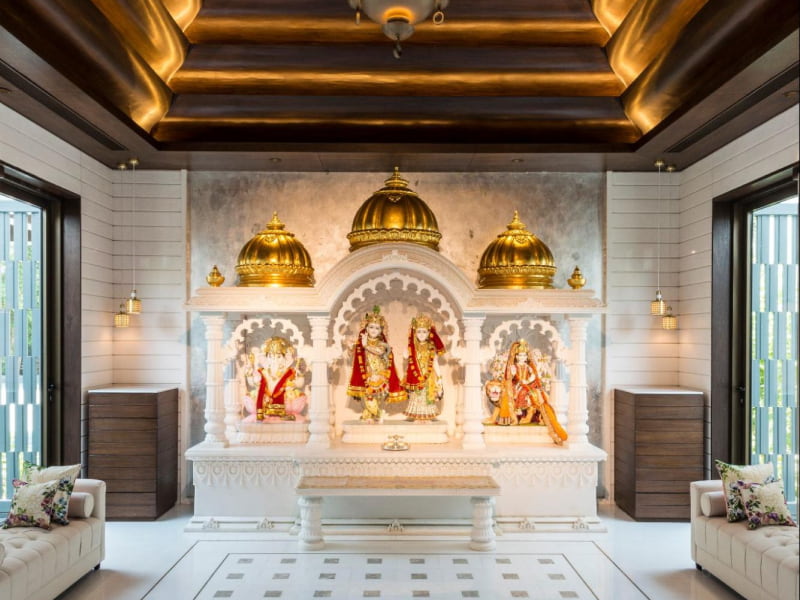 Simple wooden pooja room cupboard design for pooja room storage - Beautiful Homes