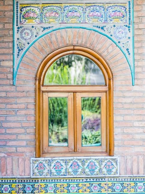 Half round window design with brick wall paneling - Beautiful Homes
