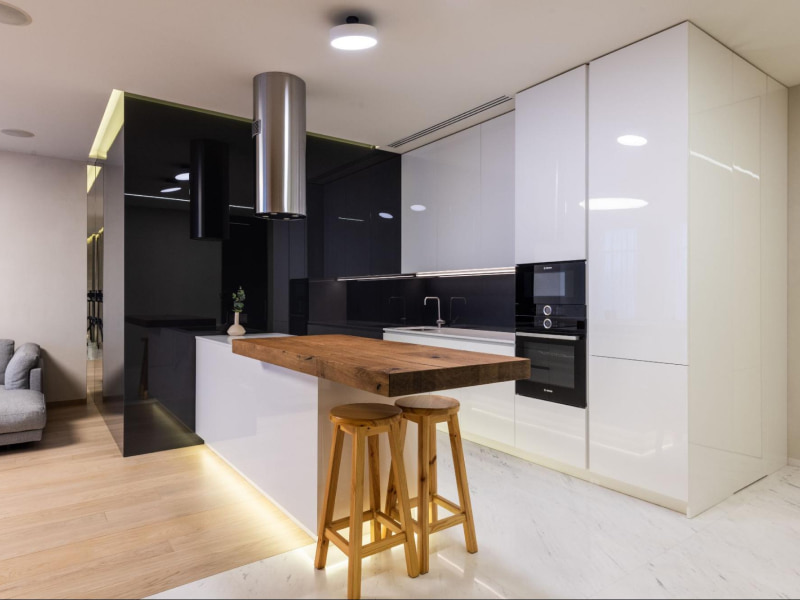 Black & white modular kitchen design with black stainless-steel appliances - Beautiful Homes