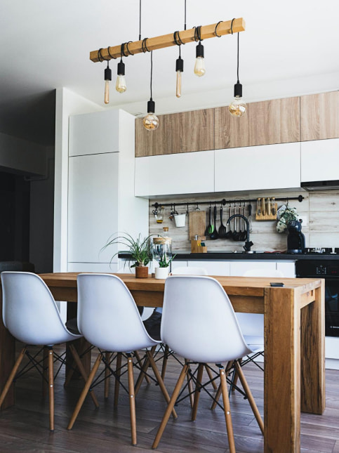Linoleum sheet flooring in a straight kitchen design with breakfast table - Beautiful Homes