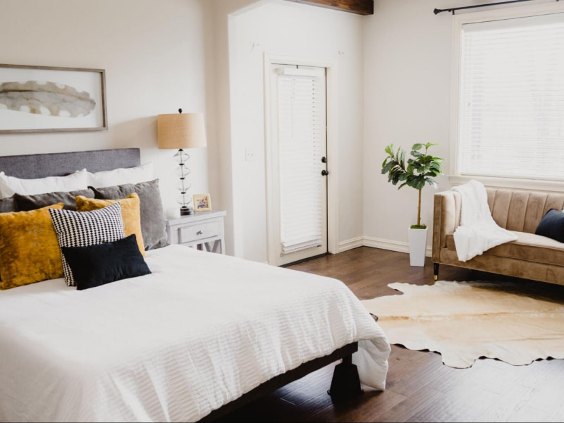 Chic patterned bedding style in this chic bedroom interior design - Beautiful Homes