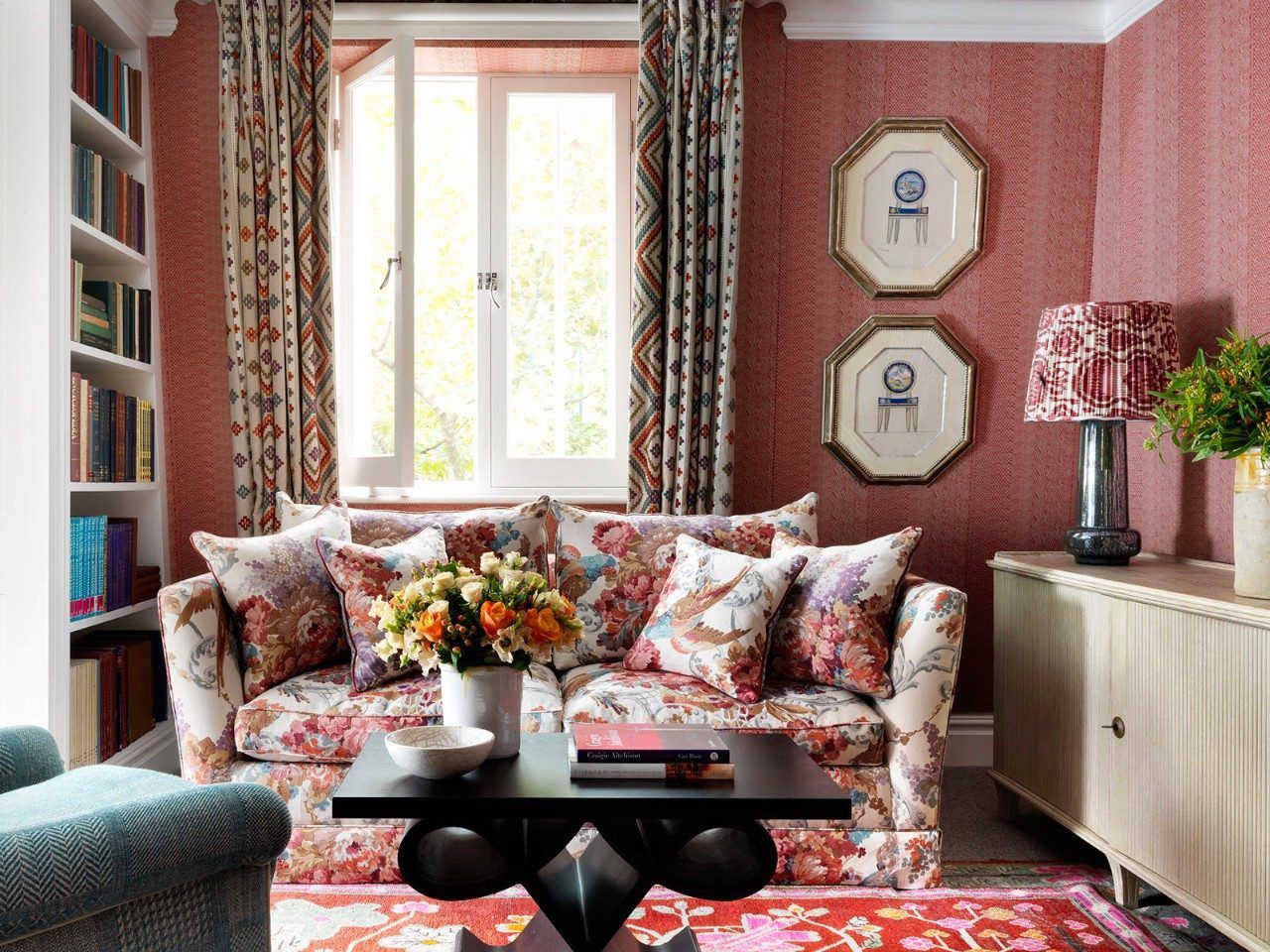 Pink living room design with floral sofa & pink wall paint - Beautiful Homes