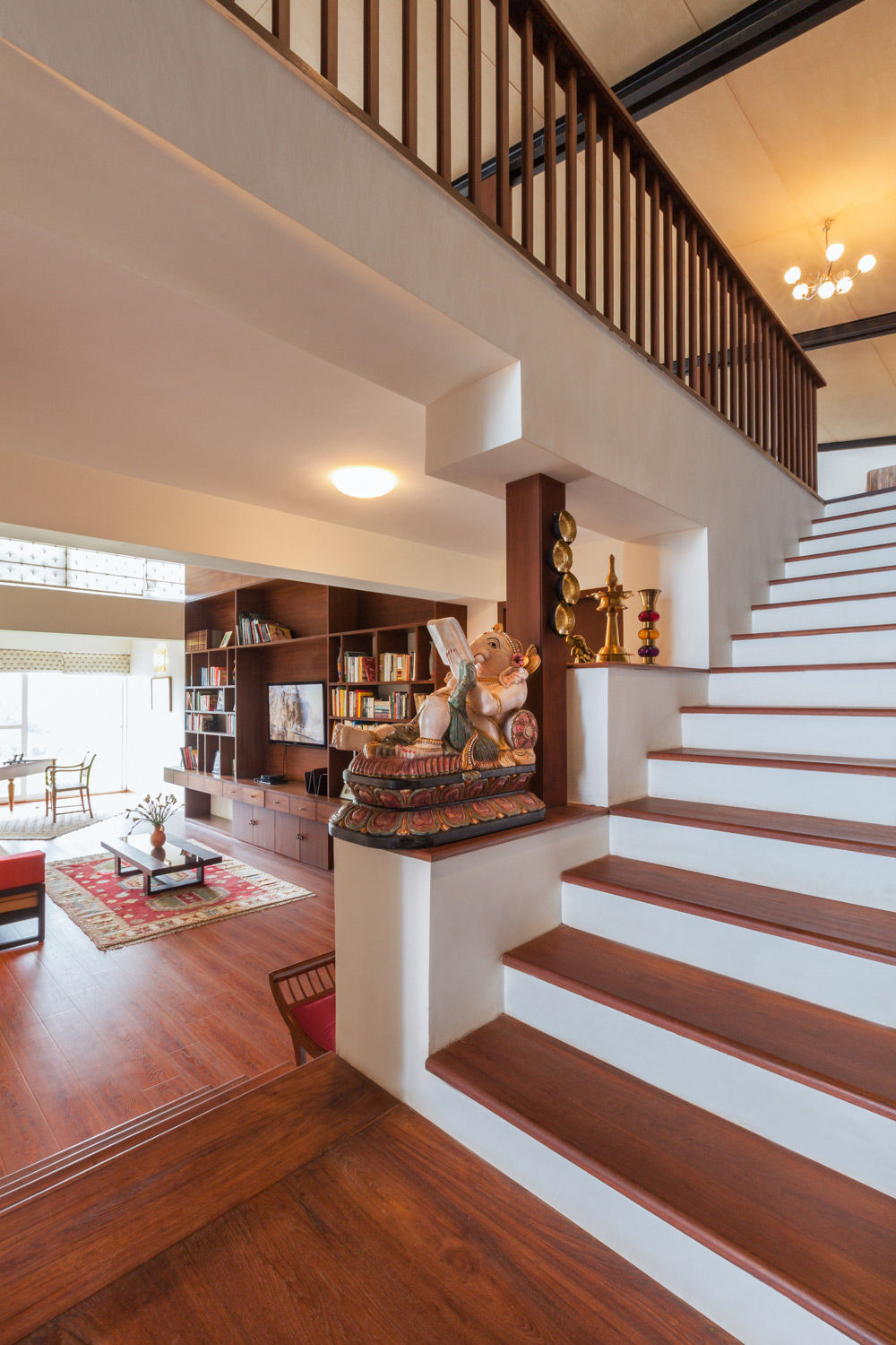 Crevices and niches are used display the showpieces at staircase area- Beautiful Homes